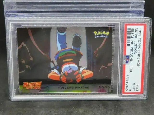 Rescuing Pikachu [Foil] #30 - Pokemon 1999 Topps Movie