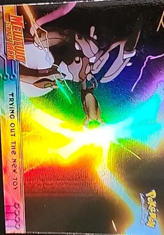 Trying Out the New Toy [Rainbow Foil] #7 - Pokemon 1999 Topps Movie