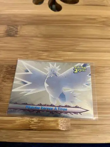 Pikachu Versus a Titan [Foil] #34 - Pokemon 2000 Topps Movie